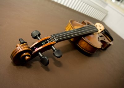violin restored on table